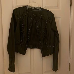 This is a BEBE leather jacket ! Perfect condition